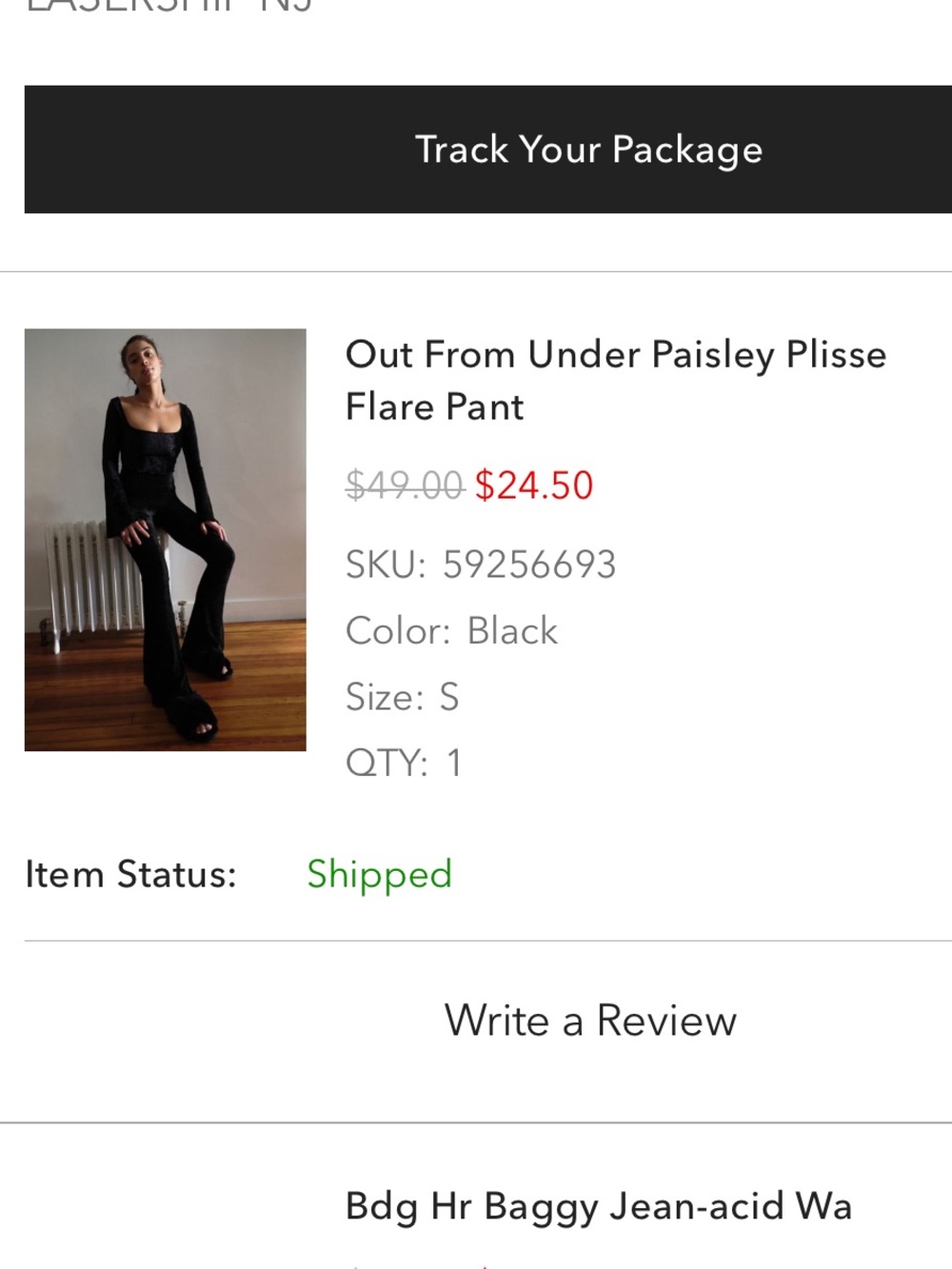 Out from under black velvet pants